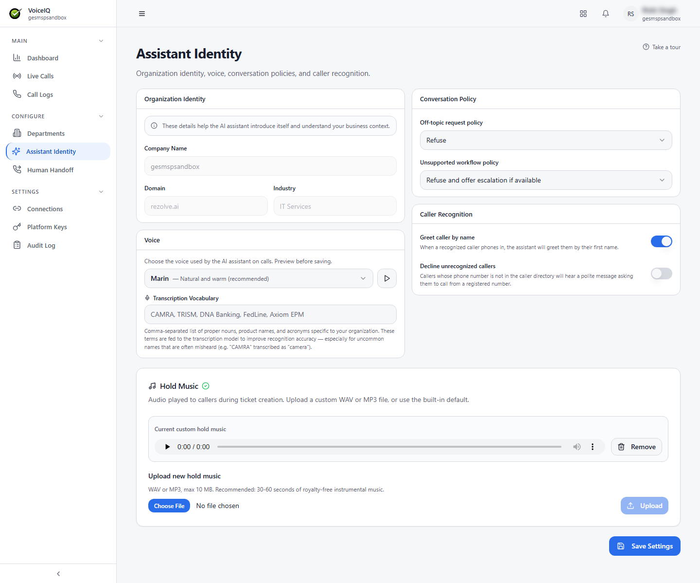 Assistant Identity page showing the Organization Identity, Voice, Conversation Policy, Caller Recognition, and Hold Music sections with a Save Settings button