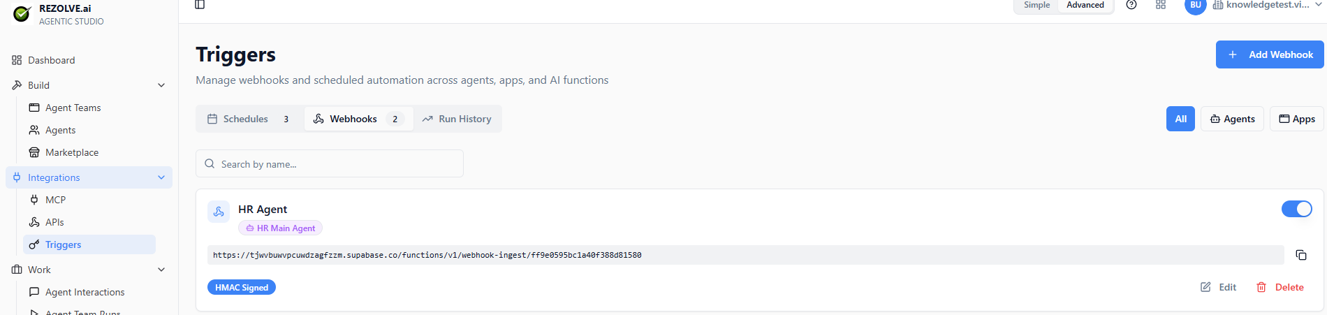 Webhooks tab: configured webhook with generated URL, HMAC-signed badge, agent target